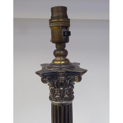 102 - An early 20thC neo classically styled silver plated table lamp, comprising a Corinthian capital, ove... 