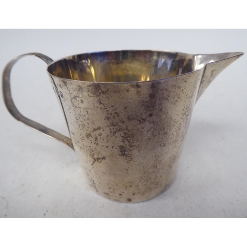 104 - A George III silver jug of round, tapered form with a loop handle  TO  London 1894  (... 