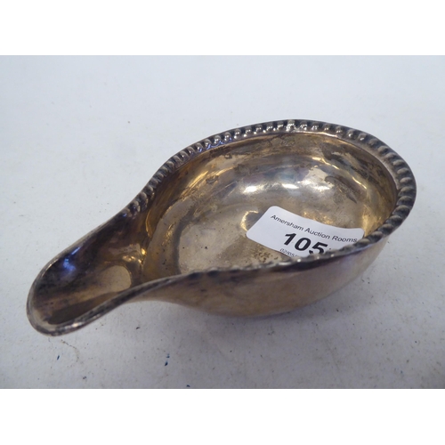 105 - An 18thC silver pap boat, the bowl with a crimped border  marks rubbed