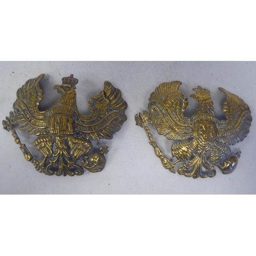 106 - Two identical German Great War brass helmet plates(Please Note: this lot is subject to the statement... 