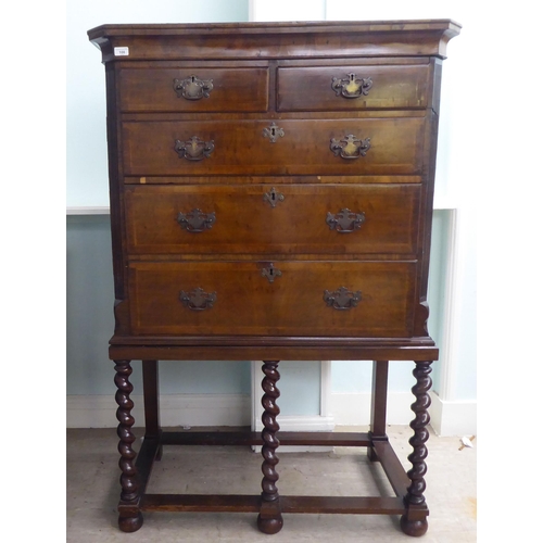 108 - A 19thC and later mahogany chest on stand, comprising two short/three long drawers, between canted f... 