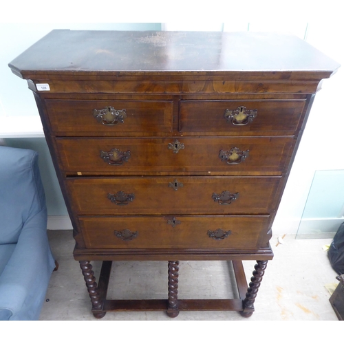 108 - A 19thC and later mahogany chest on stand, comprising two short/three long drawers, between canted f... 