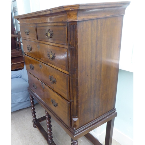 108 - A 19thC and later mahogany chest on stand, comprising two short/three long drawers, between canted f... 