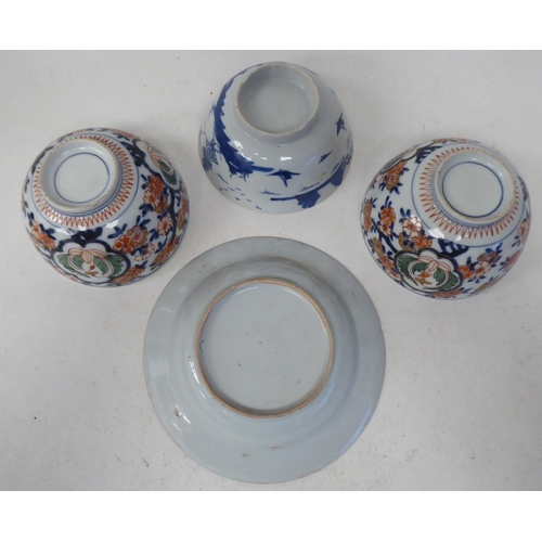 109 - 19thC Chinese porcelain: to include a pair of footed bowls, decorated in colours with floral designs... 