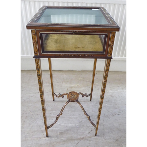 110 - A late 19th/early 20thC satinwood, hinged top display table, decorated in delicately painted flora, ... 