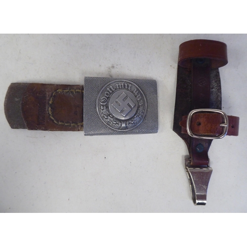 111 - A German Third Reich era military belt buckle; and a buckled brown hide dagger strap(Please Note: th... 