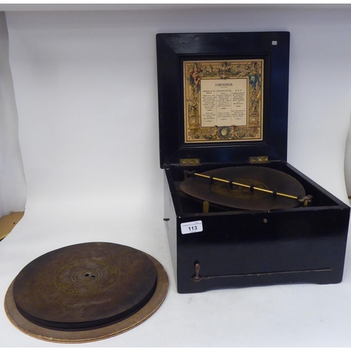 113 - A late 19thC Brevete Patent black lacquered and gilded table-top Symphonion of box design with a mec... 