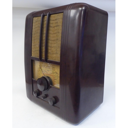 114 - A vintage Ekco Type UAW70 All Electric, bakelite cased radio receiver with a printed dial  20