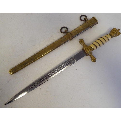 117 - A German Third Reich period Naval officer's dress dagger with an eagle pommel, over the wire bound c... 