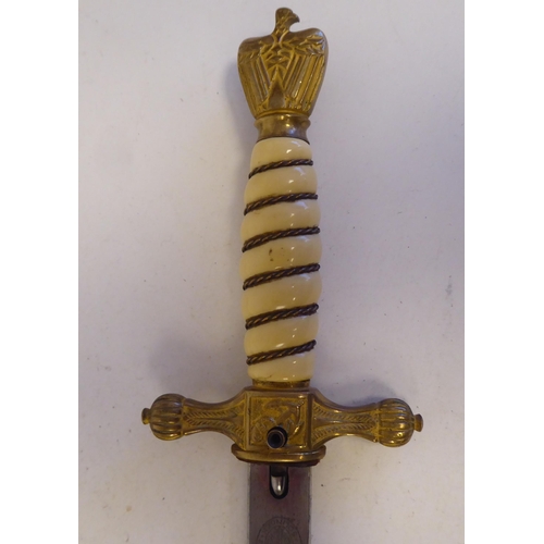 117 - A German Third Reich period Naval officer's dress dagger with an eagle pommel, over the wire bound c... 