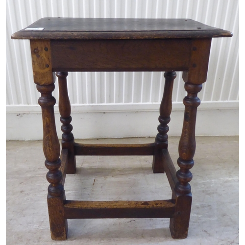 118 - An 18thC style, rustic oak joint stool with a dowelled top, over a vase turned and block underframe