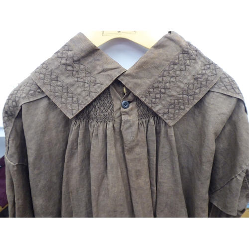 121 - A Continental artisan's brown calico pleated smock with simple decoration to the colour