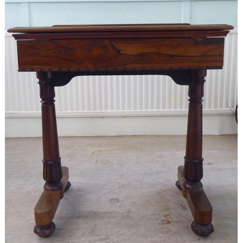 126 - A William IV rosewood reading table with a hinged top, over a height adjustable lectern, on a ratche... 