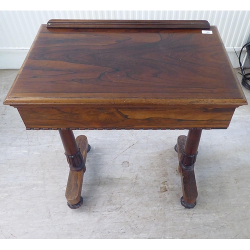 126 - A William IV rosewood reading table with a hinged top, over a height adjustable lectern, on a ratche... 