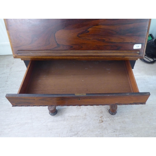 126 - A William IV rosewood reading table with a hinged top, over a height adjustable lectern, on a ratche... 