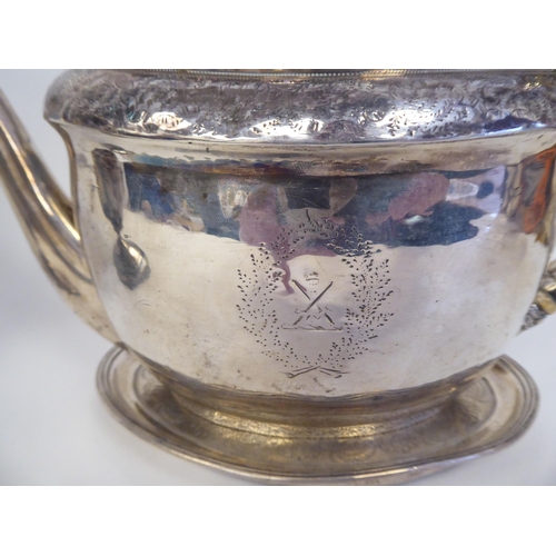 139 - A George III silver five piece tea set of oval form with engraved ornament, including armorials ... 