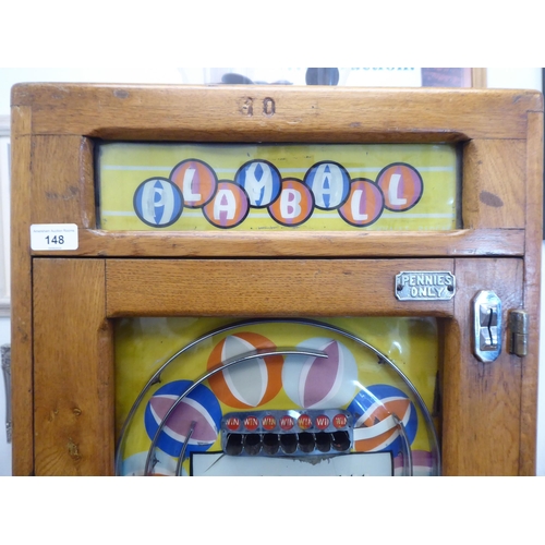 148 - A vintage penny-in-the-slot, mechanical 'Playball' bagatelle machine, in a wall mountable light oak ... 