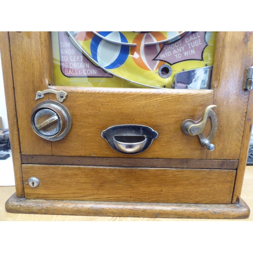 148 - A vintage penny-in-the-slot, mechanical 'Playball' bagatelle machine, in a wall mountable light oak ... 