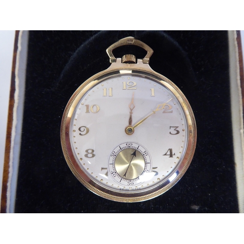 149 - A 1930s 9ct gold slim cased pocket watch, the keyless movement faced by a gilded Arabic Champagne di... 