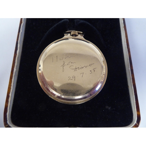 149 - A 1930s 9ct gold slim cased pocket watch, the keyless movement faced by a gilded Arabic Champagne di... 