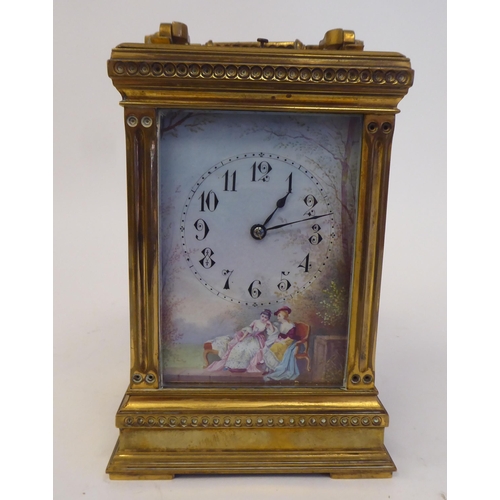 158 - An early 20thC lacquered brass cased carriage clock with reeded corner pillars and scrolled friezes,... 