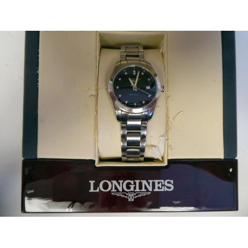 164 - A lady's Longines Conquest Classic stainless steel cased bracelet wristwatch with an exhibition back... 