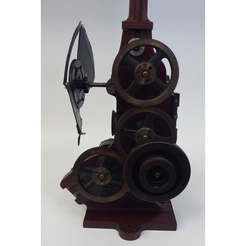 185 - A Pathe Freres, Paris, circa 1906 maroon painted iron, hand crank projector  No.4582, on a plinth  2... 