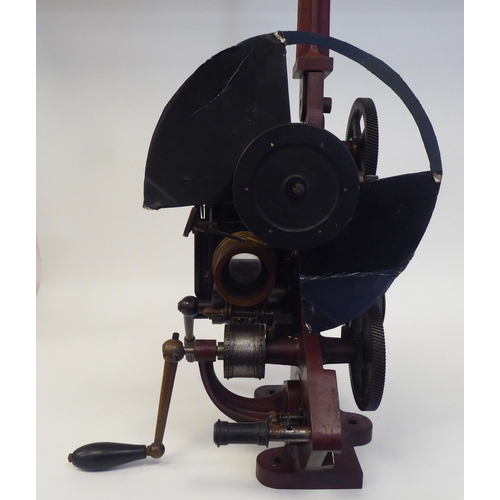 185 - A Pathe Freres, Paris, circa 1906 maroon painted iron, hand crank projector  No.4582, on a plinth  2... 