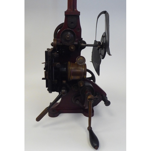 185 - A Pathe Freres, Paris, circa 1906 maroon painted iron, hand crank projector  No.4582, on a plinth  2... 