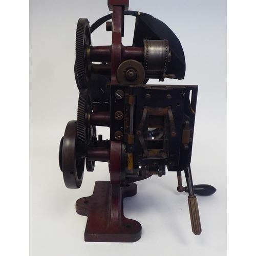 185 - A Pathe Freres, Paris, circa 1906 maroon painted iron, hand crank projector  No.4582, on a plinth  2... 