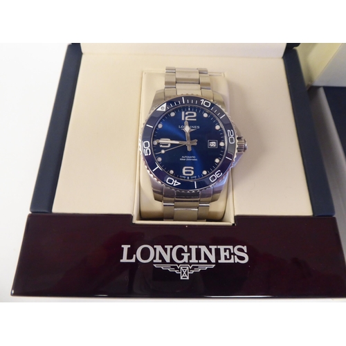 48 - A Longines stainless steel bracelet wristwatch, the automatic movement with sweeping seconds, a date... 