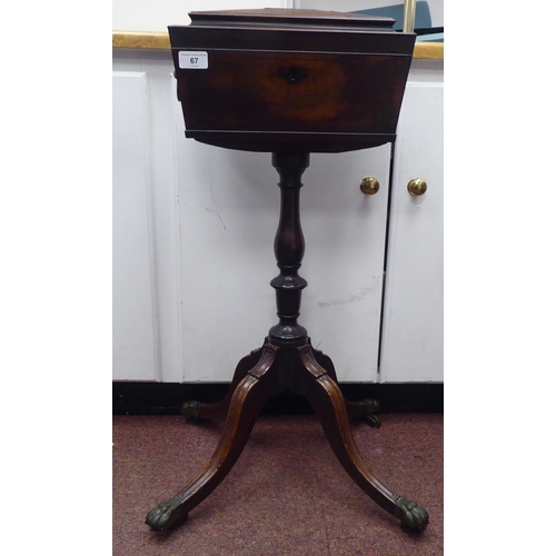 67 - An early 19thC mahogany veneered tea casket of sarcophagus form, the hinged lid enclosing a pair of ... 