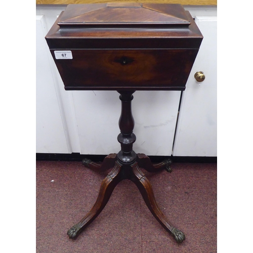 67 - An early 19thC mahogany veneered tea casket of sarcophagus form, the hinged lid enclosing a pair of ... 