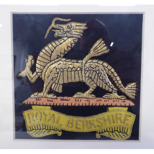 69 - A Queen's Regiment and a Royal Berkshire Regiment embroidered, gold and silver coloured metal wire p... 