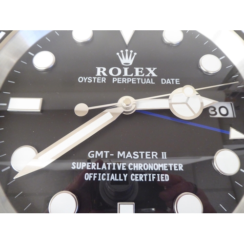 78 - A dealer display, advertising wall timepiece for Rolex Oyster Perpetual Date; the movement faced by ... 