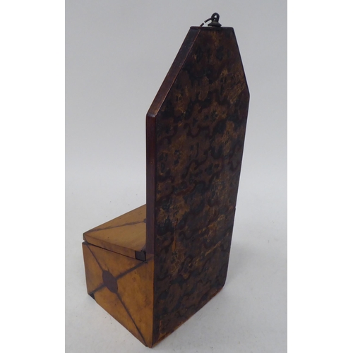 80 - An early 19thC treen satinwood wall hanging salt box with an extended backplate, over an angled hing... 