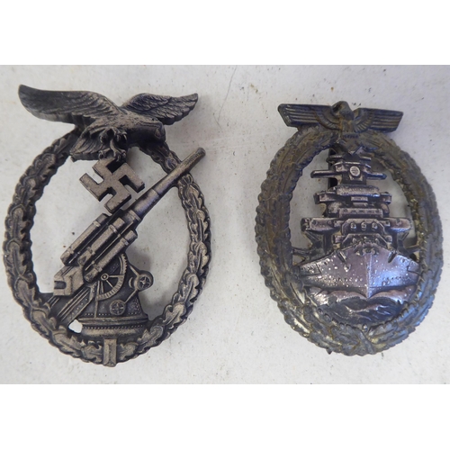 86 - A German Kriegsmarine breast badge, by Schwerin of Berlin; and a Luftwaft Ack Ack breast badge(Pleas... 