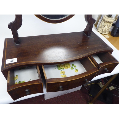 87 - An Edwardian satinwood string inlaid mahogany toilet mirror, the oval plate pivoting on shaped horns... 