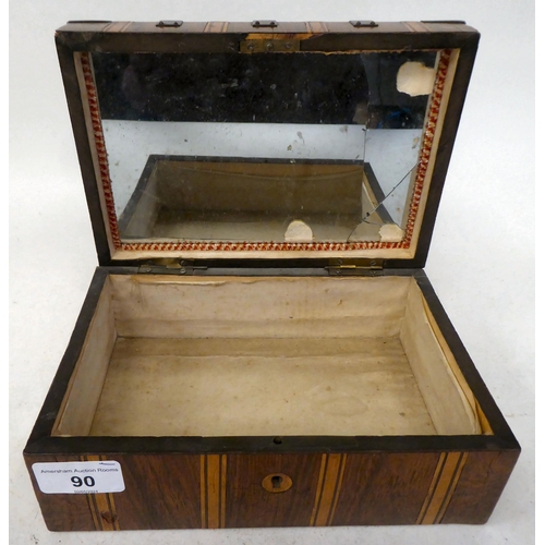 90 - A mid 19thC casket, decorated in a variety of veneers with rivetted, angled metal reinforcement, str... 