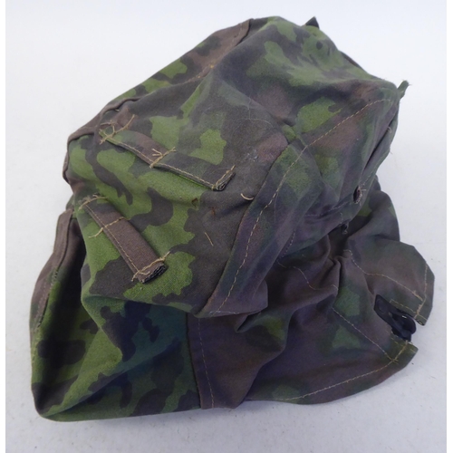 91 - A German military camouflage smock, cap and helmet cover(Please Note: this lot is subject to the sta... 