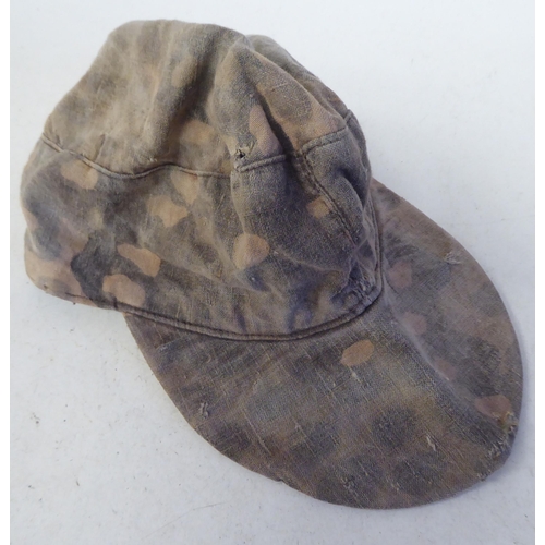 91 - A German military camouflage smock, cap and helmet cover(Please Note: this lot is subject to the sta... 