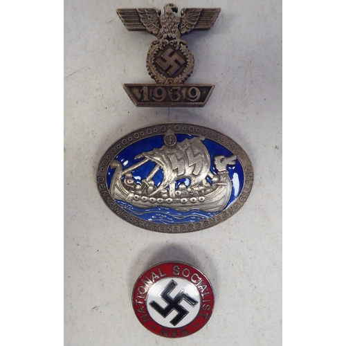 94 - German military badges, viz. a 1939 example, incorporating emblems; a National Socialist N.95 for a ... 