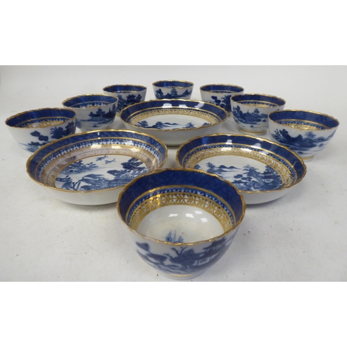 95 - Late 18thC porcelain teaware, decorated in blue, white and gilding with Chinese seascapes, small bui... 