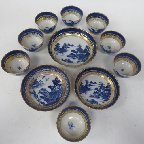 95 - Late 18thC porcelain teaware, decorated in blue, white and gilding with Chinese seascapes, small bui... 