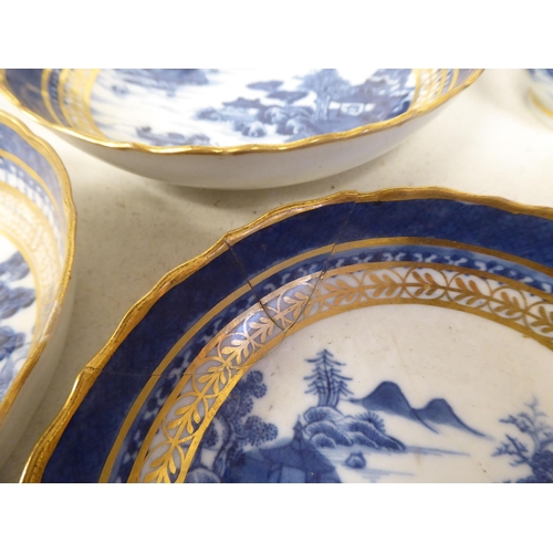 95 - Late 18thC porcelain teaware, decorated in blue, white and gilding with Chinese seascapes, small bui... 