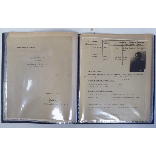 96 - A German World War II era SS flag; and an album of miscellaneous German military orders/documents(Pl... 