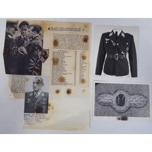 96 - A German World War II era SS flag; and an album of miscellaneous German military orders/documents(Pl... 