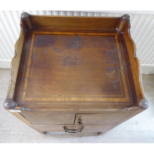 98 - An early 19thC crossbanded and string inlaid mahogany night commode, the galleried tray top with cut... 