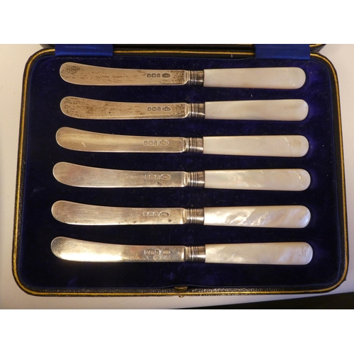 136 - A set of six silver dessert knives, on mother-of-pearl handles  cased; and a matched set of contempo... 