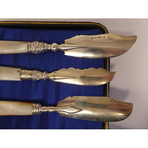 136 - A set of six silver dessert knives, on mother-of-pearl handles  cased; and a matched set of contempo... 